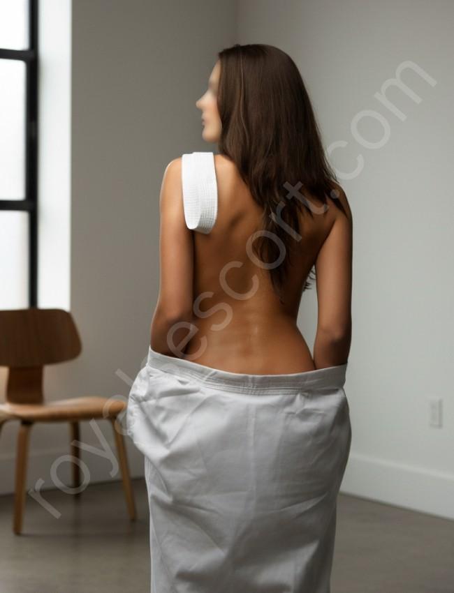 Leading Hyderabad Call Girl Escort Velmira in room give back pose 