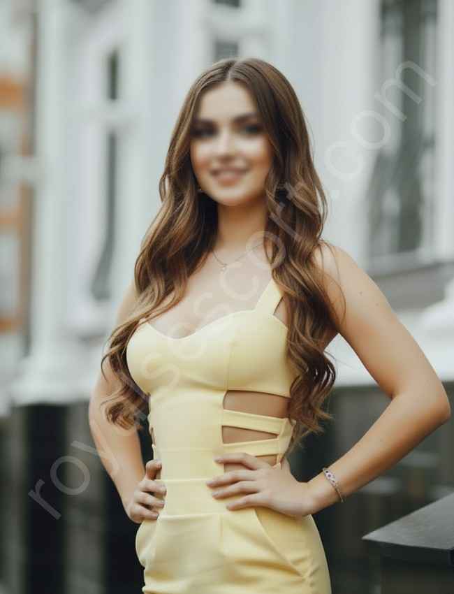 High Profile call girl Aadhira wearing yellow dress and give side pose and smiling