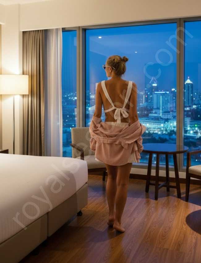 VIP call girl escort Mahvish standing in room and see the glass window in luxury room in Hyderabad 