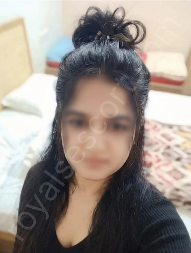 Independent Escort service in bengluru by Miya wearing black dress taking selfie in hotel room