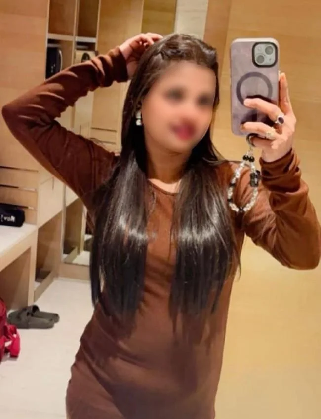 VIP Escort Navya in Rishikesh taking selfi in brown gown dress