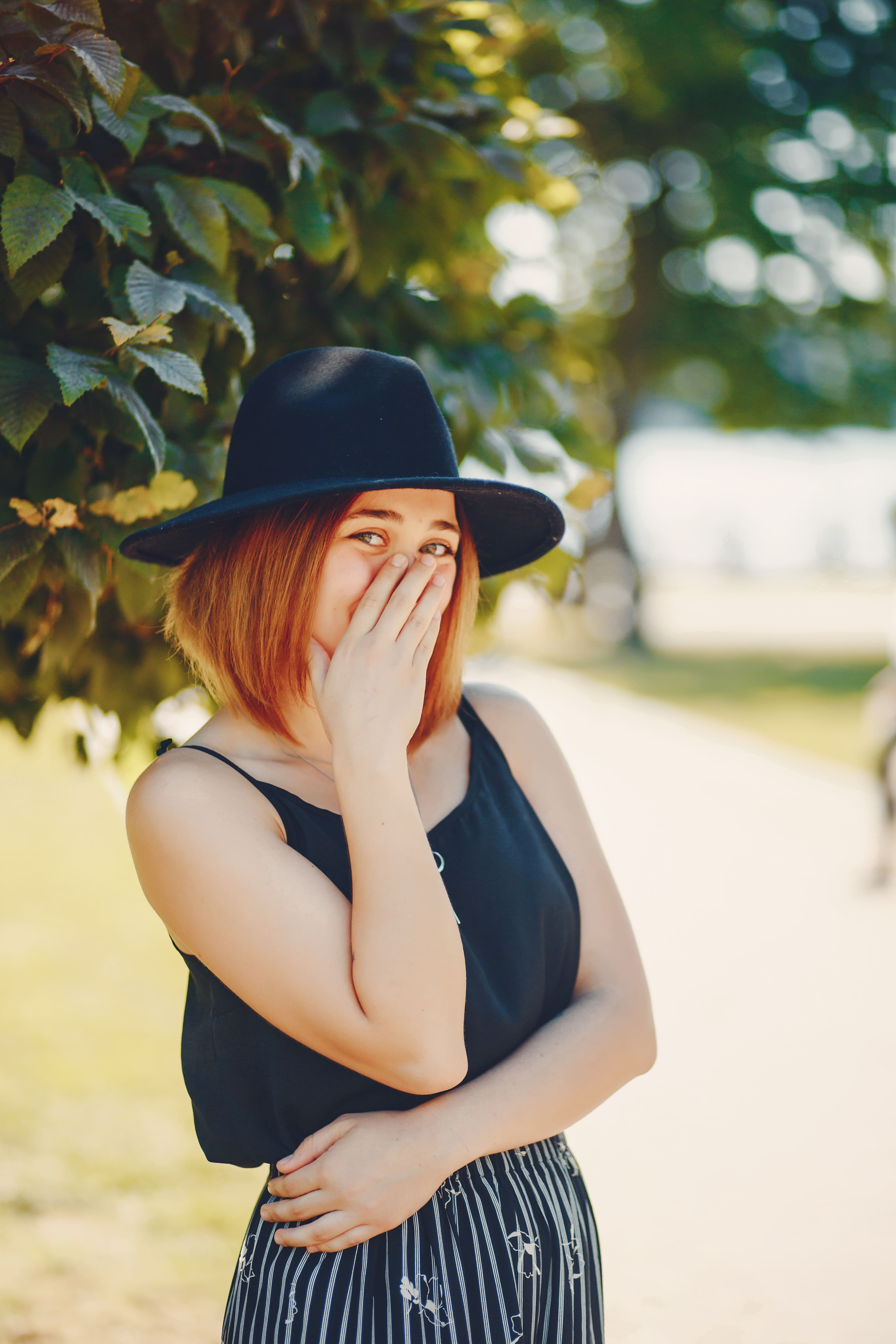 Independent Pune Escort Riya wearing black top and give pose in garden