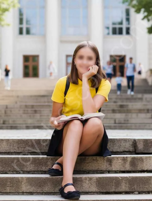 Yashika Independent college escort wearing college dress and sitting on stairs in zirakpur